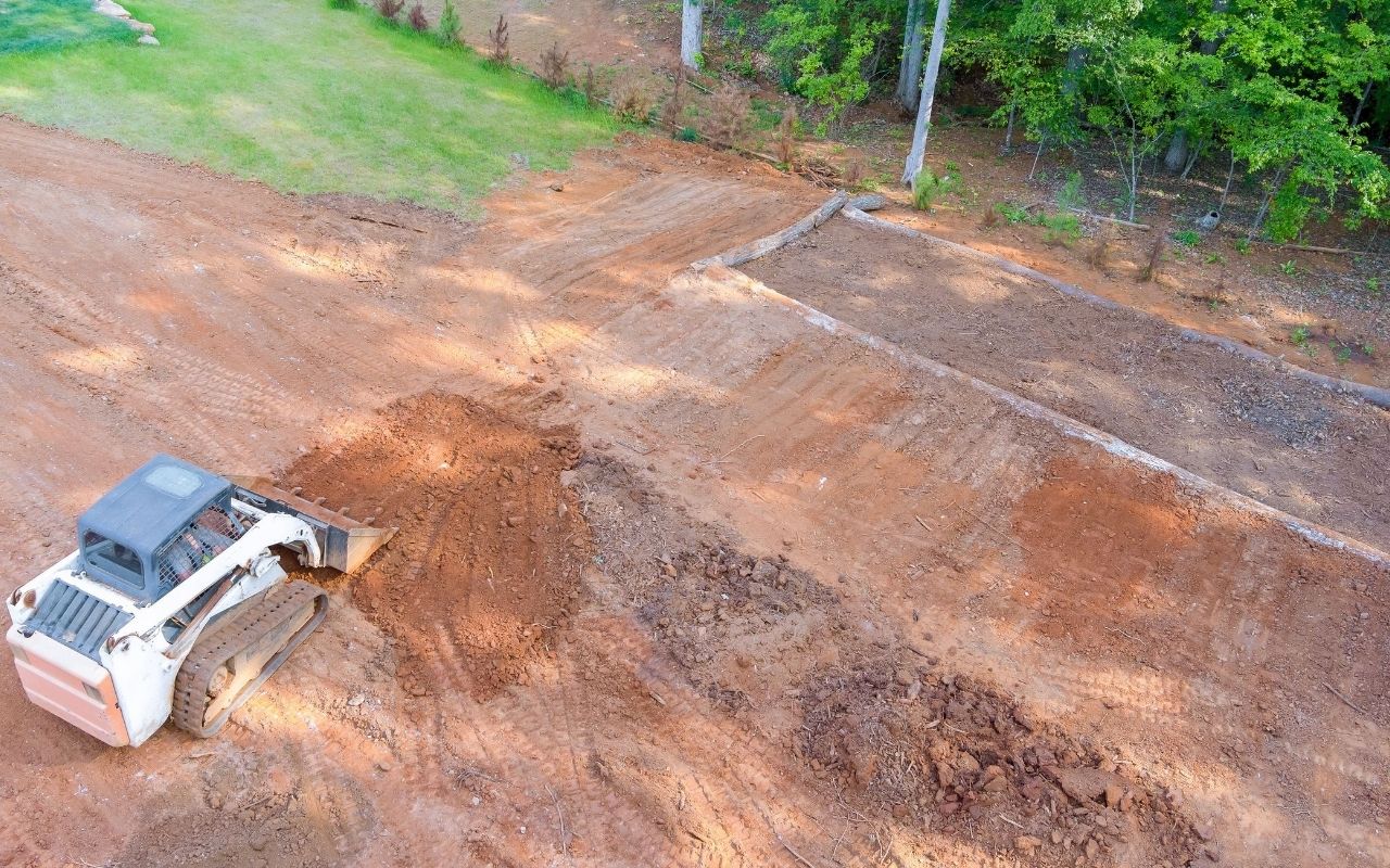 Yard being regraded to improve water flow
