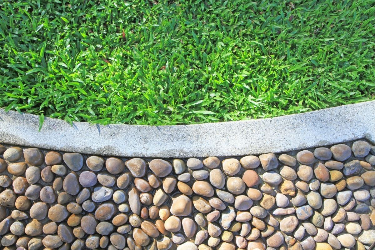 Garden with natural stone edging and flower beds