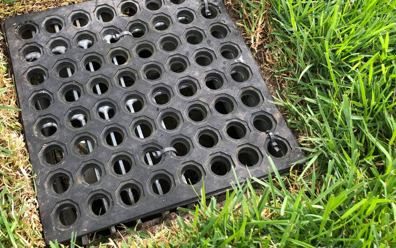 Diagram showing proper french-drain trench depth guidelines and slope alignment