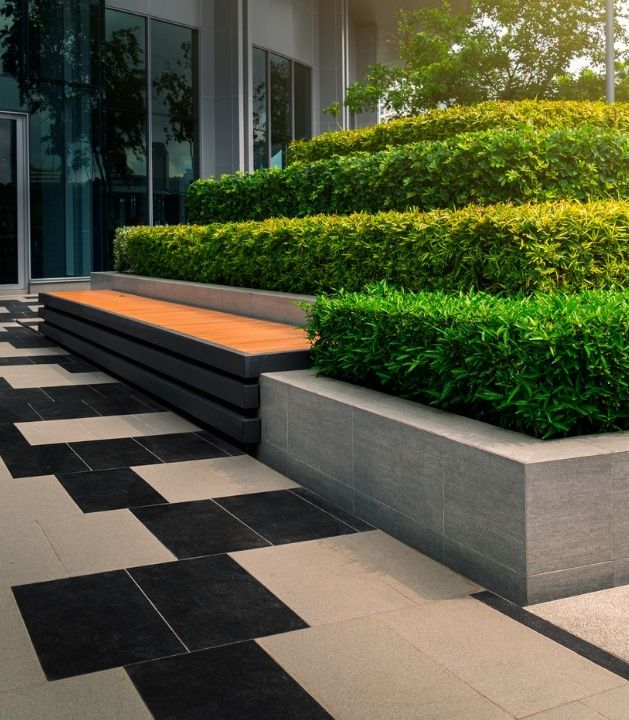 Well-maintained commercial building with trimmed shrubs and clean lawns